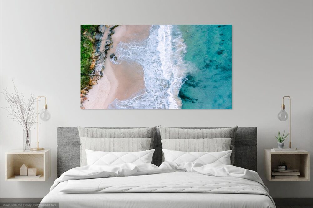 drone photograph of a wave crashing at norah head beach